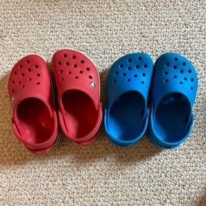 Toddler crocs size 6/7, one red pair and one blue pair